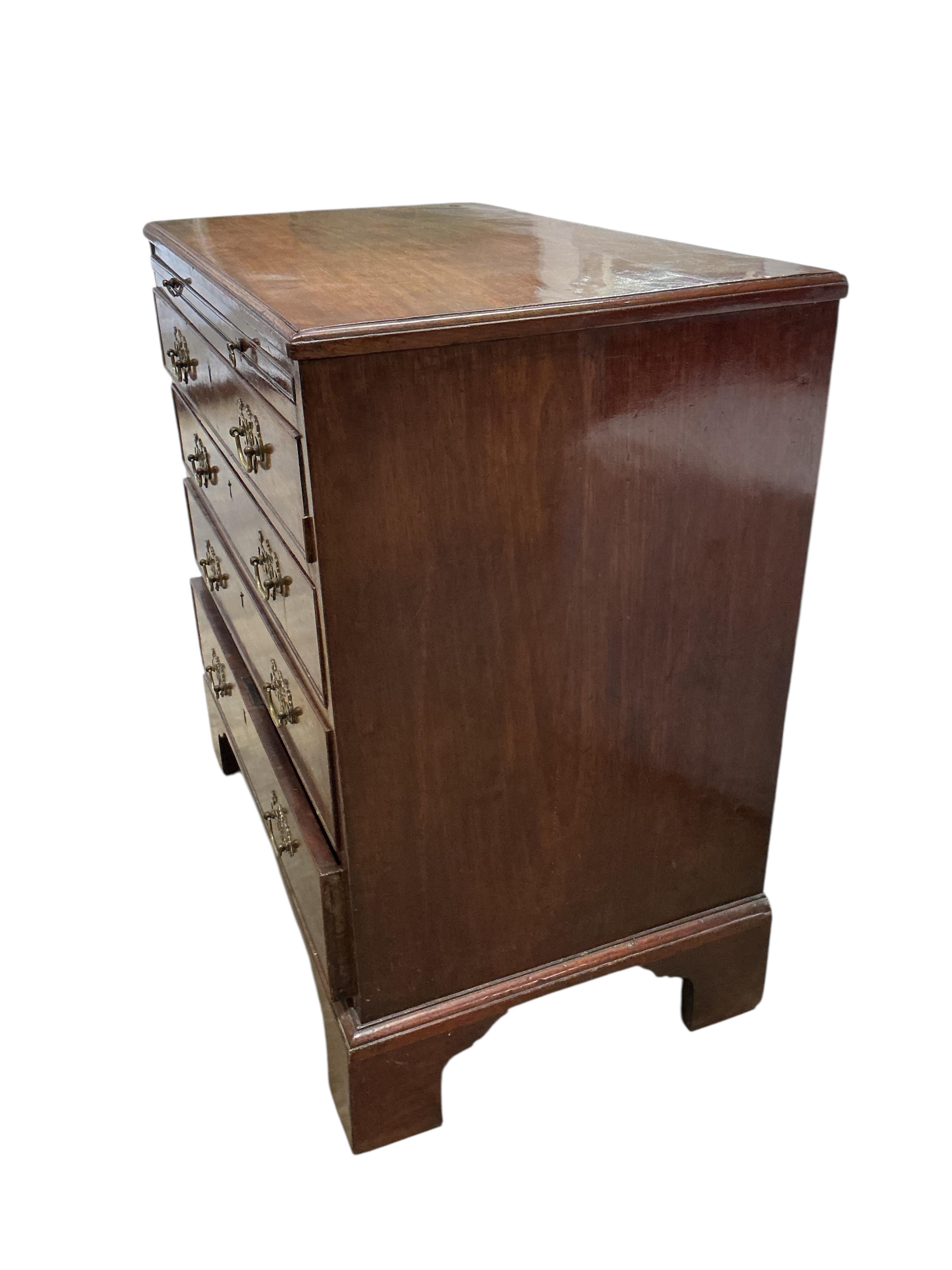 A small George III mahogany four drawer chest with brushing slide, width 78cm, depth 46cm, height 79cm